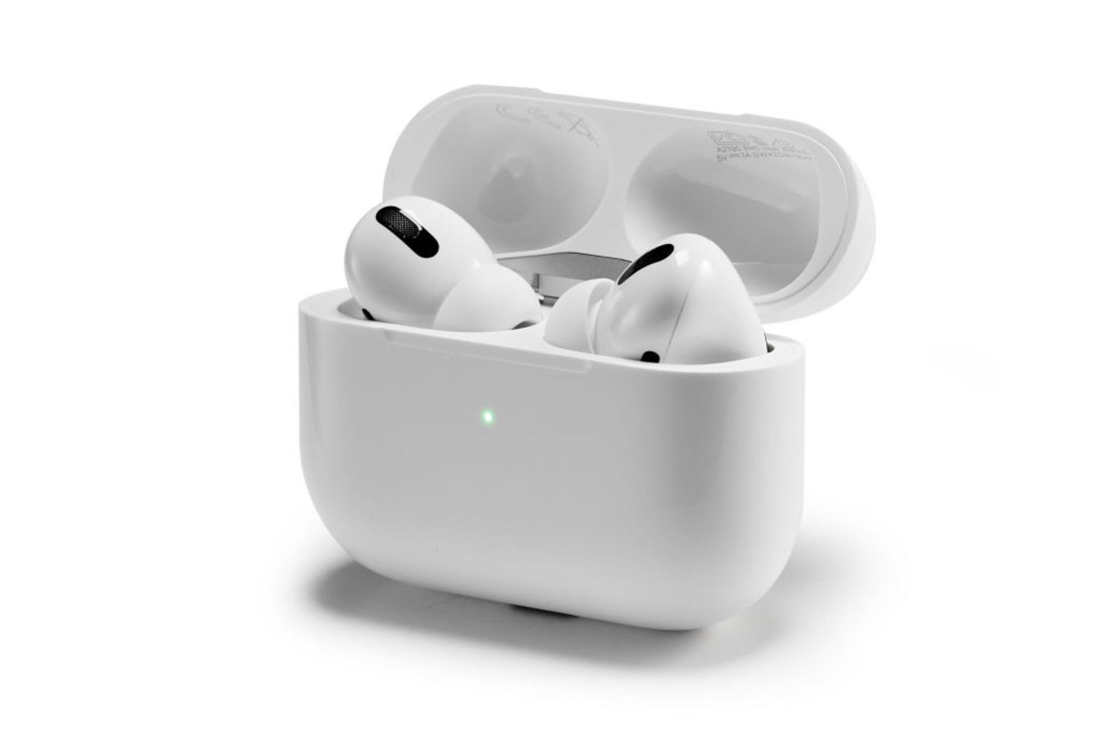 AirPods in their case with the status light illuminated.